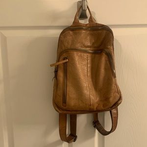 Leather purse backpack with floral detail